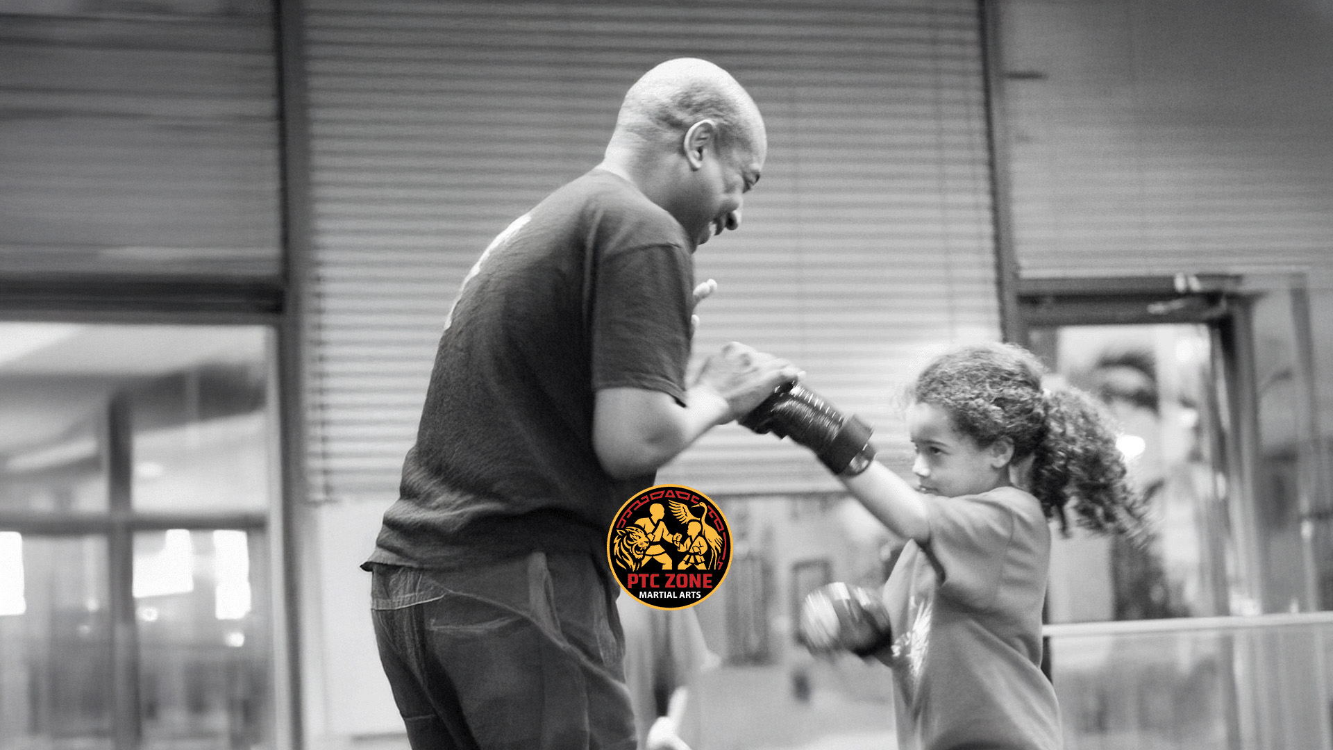 Personal coaching during a young student's martial arts practice